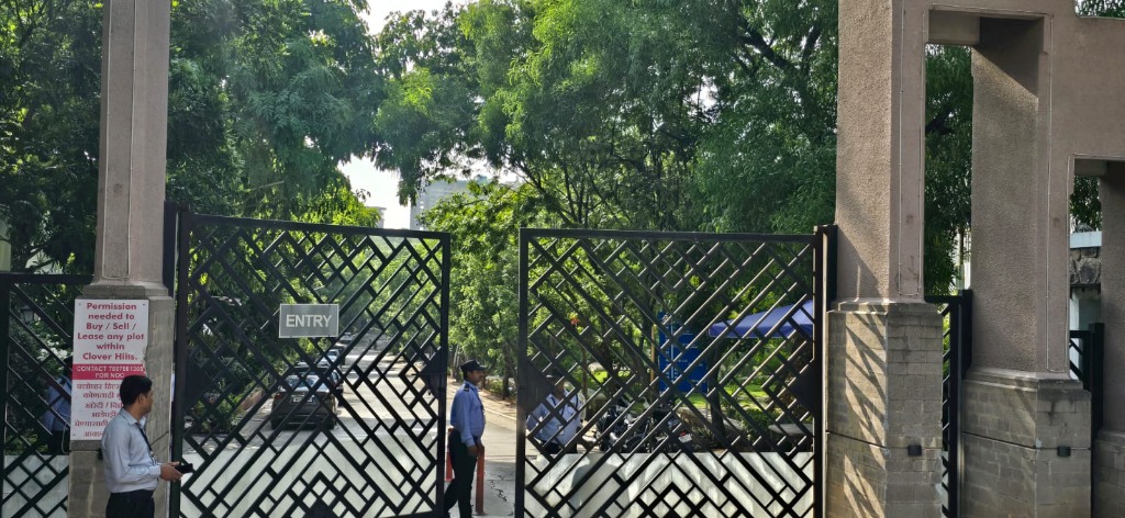 Security guard managing gate entry at residential complex